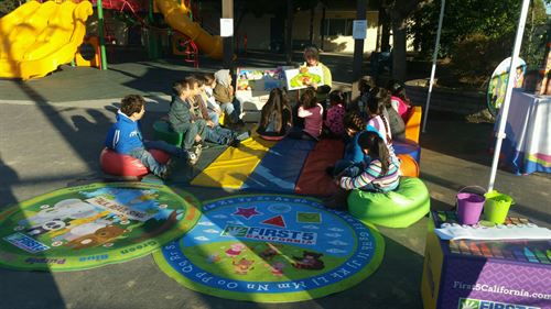 first 5 epress event children sitting on mats